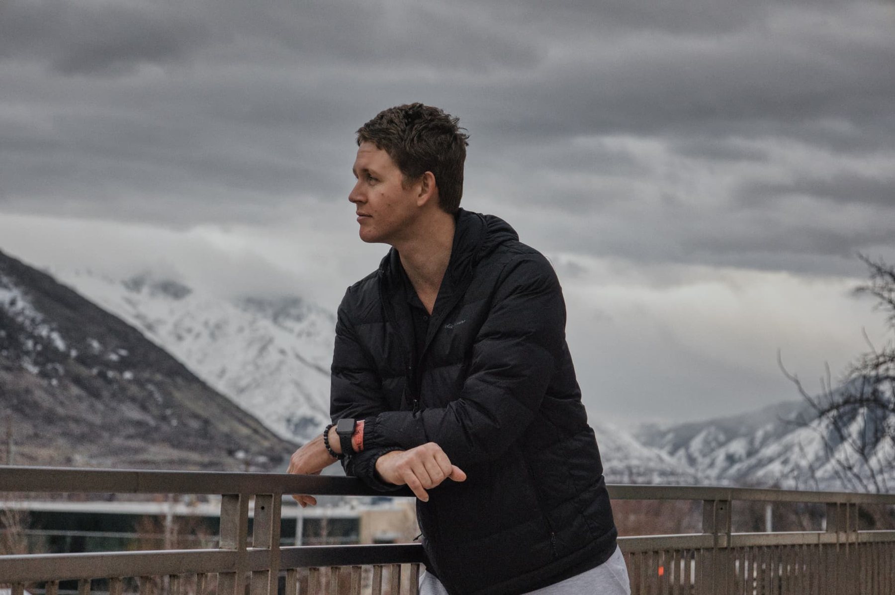 Caleb Bow overlooking snow-covered mountains